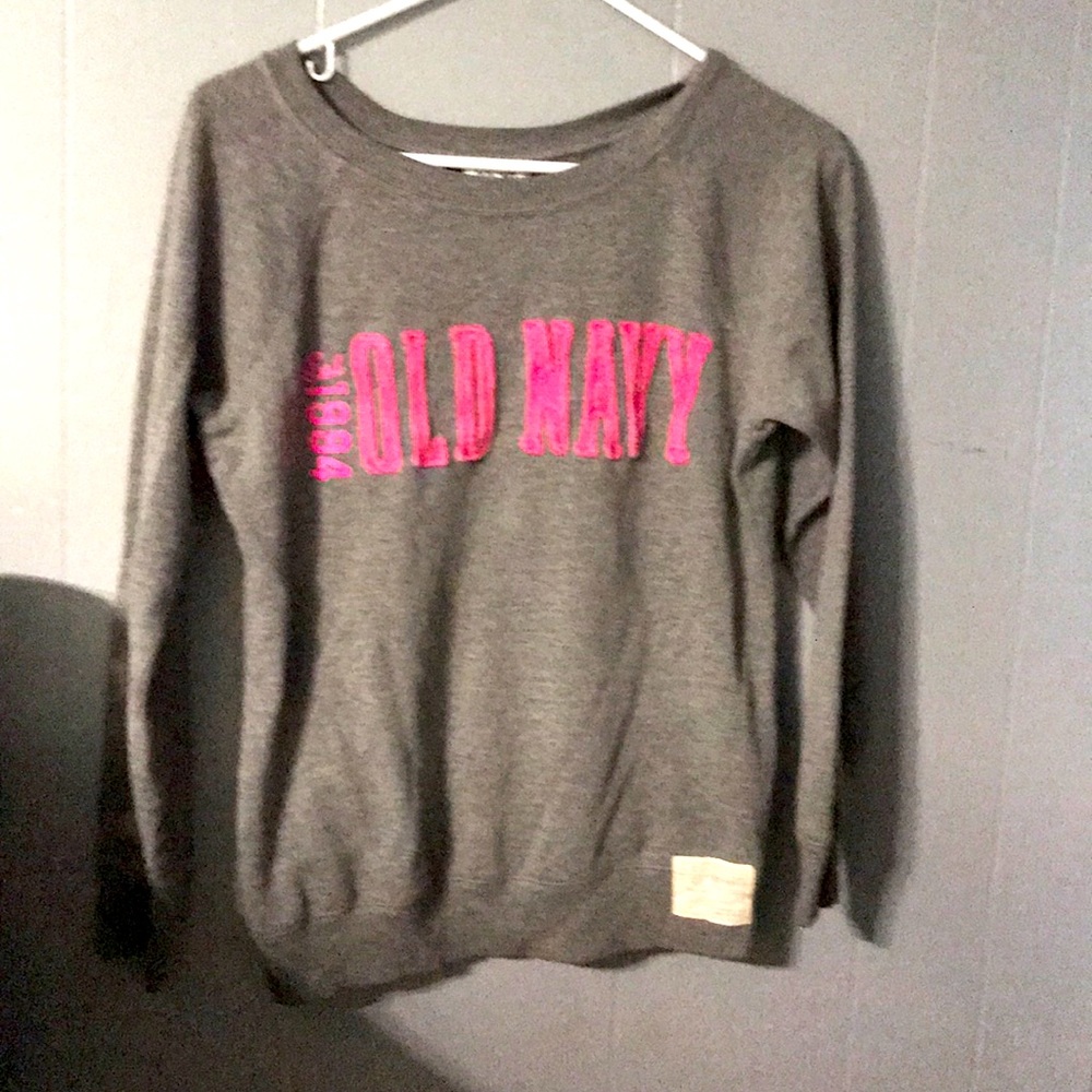 A grey and pink crew neck